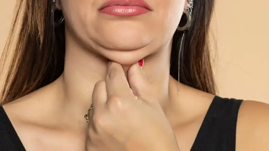 An image of a woman with double chin, sad, worried : Non Surgical Double Chin Removal Treatment in Taunton, UK