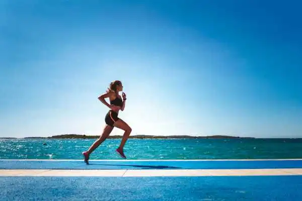 Woman running showing strong leg muscle Taunton